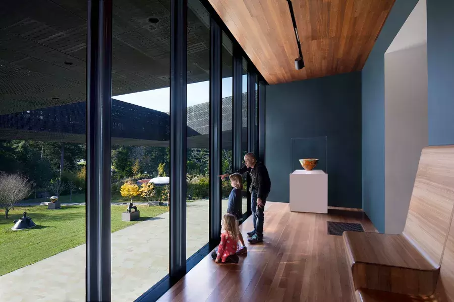 Family looking out the window at the de Young museum